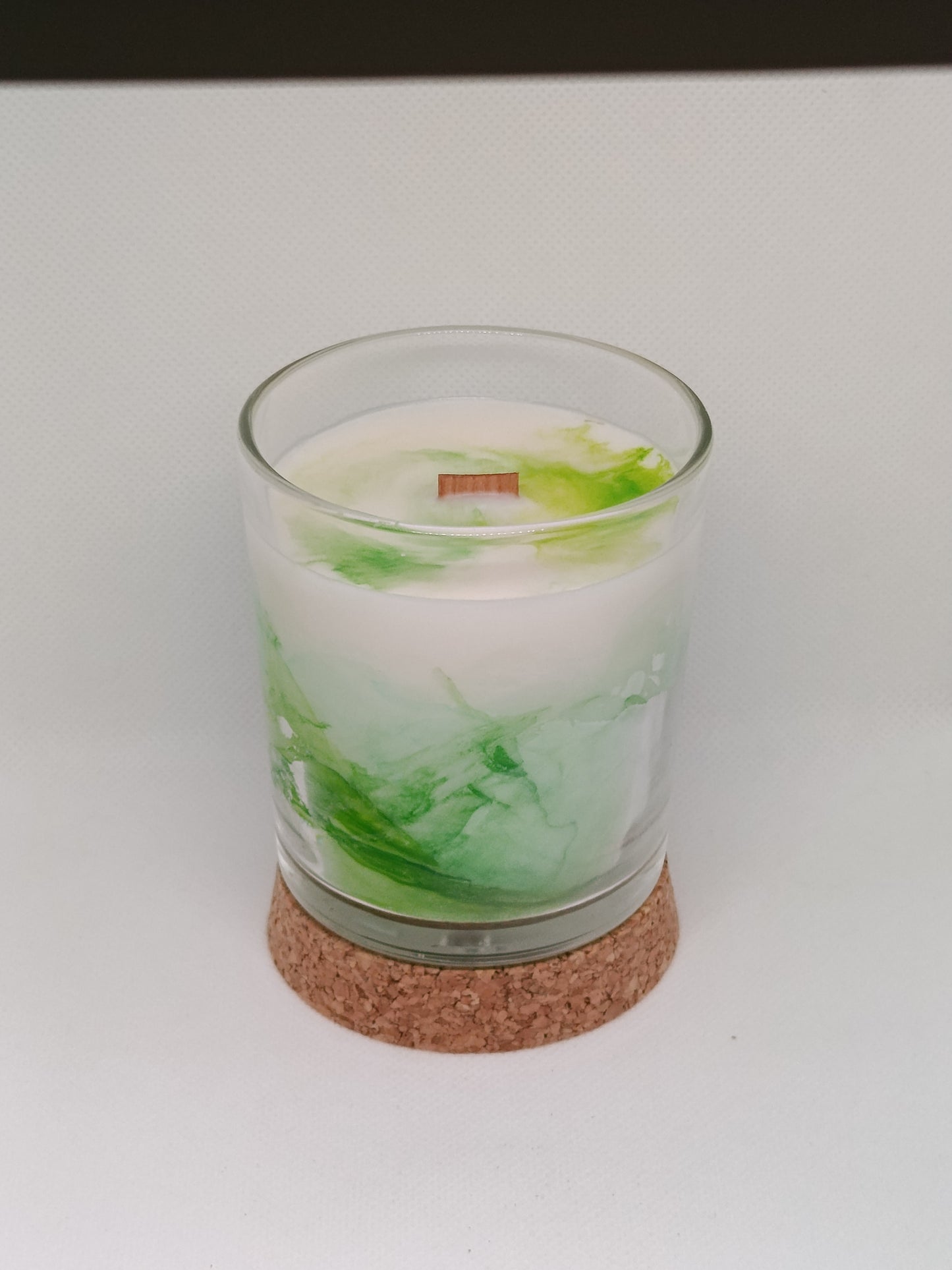 Vela aromática marmoleada en vaso