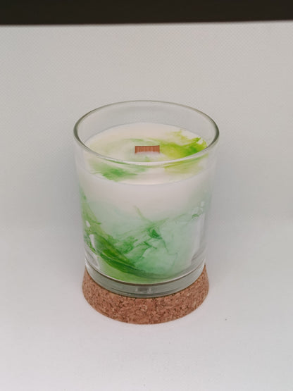 Vela aromática marmoleada en vaso