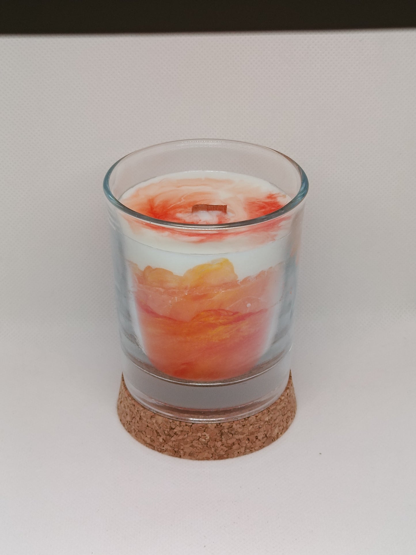 Vela aromática marmoleada en vaso