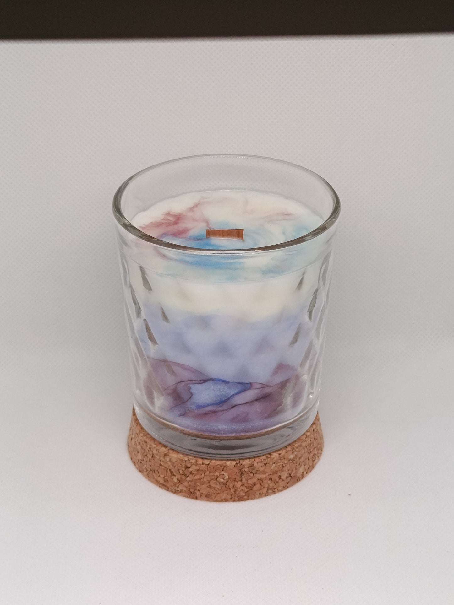 Vela aromática marmoleada en vaso