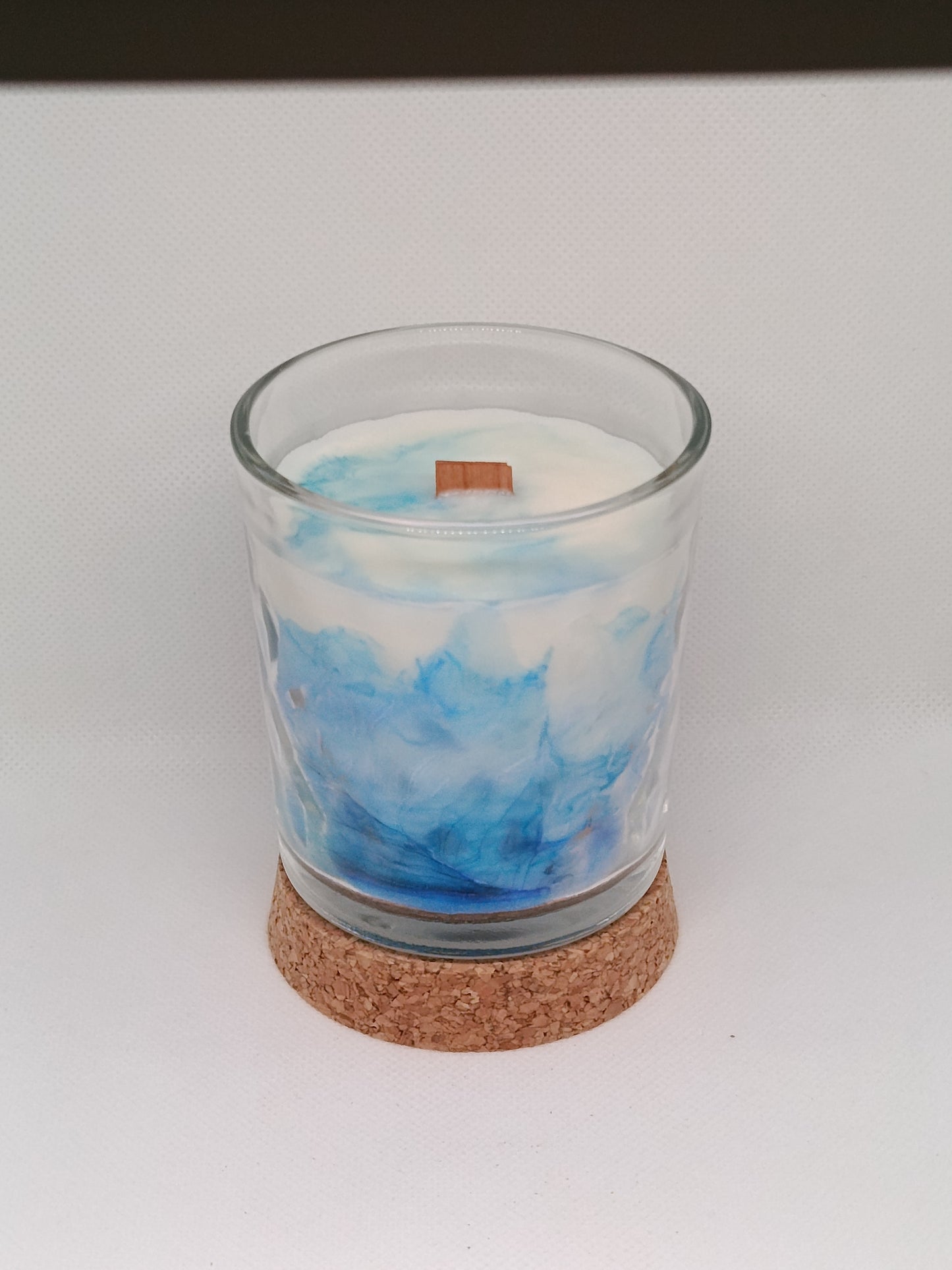 Vela aromática marmoleada en vaso