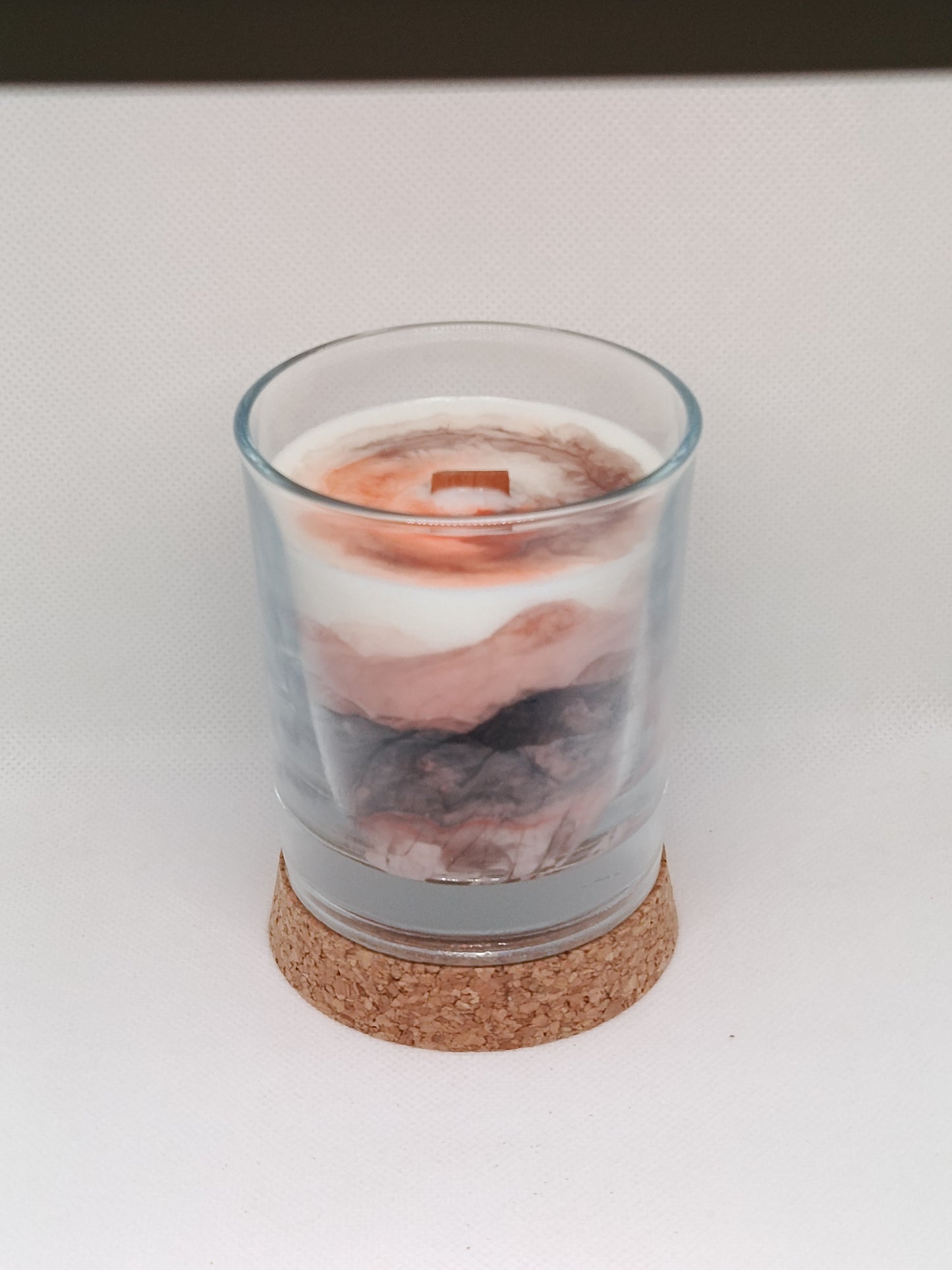 Vela aromática marmoleada en vaso